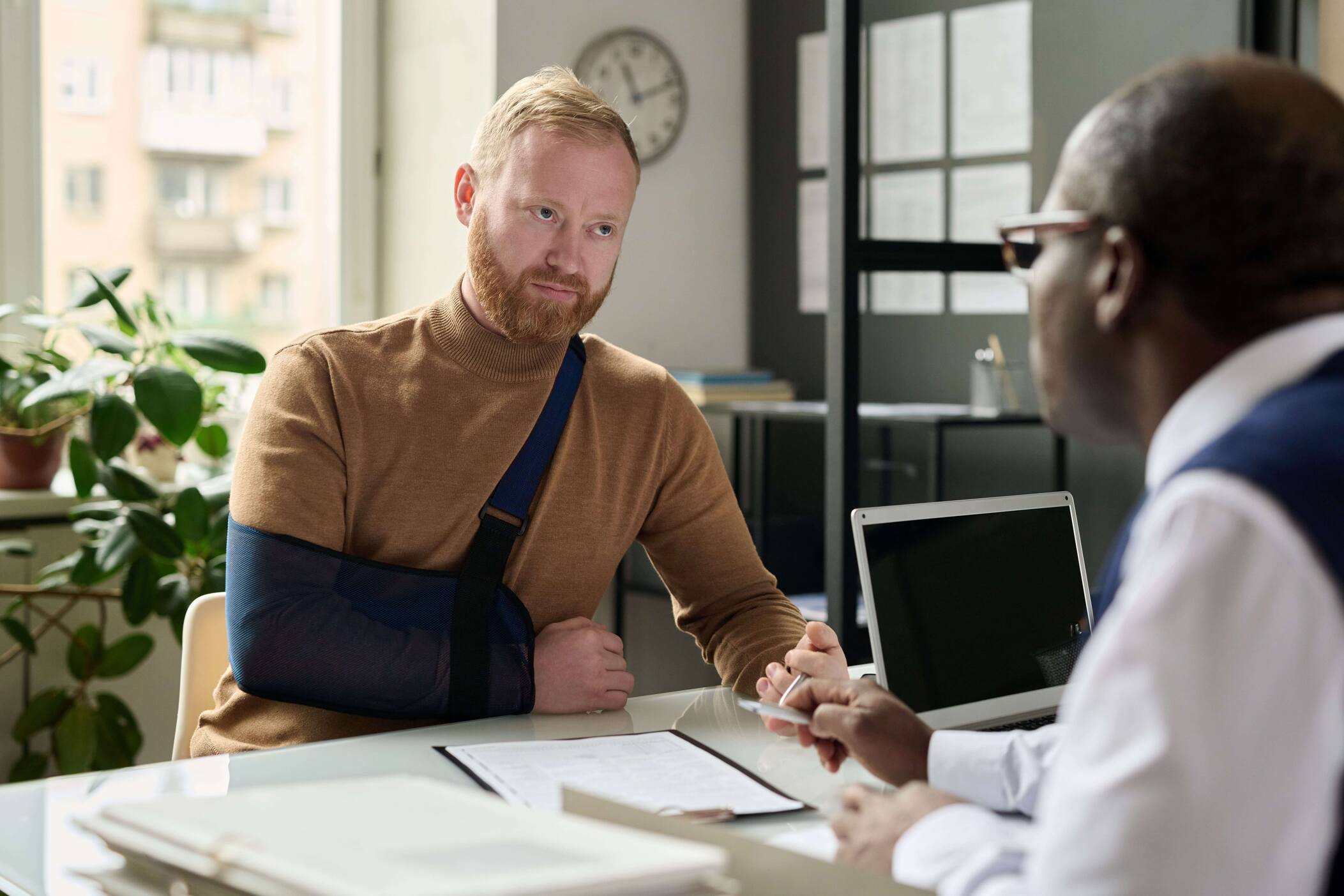 A person talking to a legal team about nevada workers compensation after an accident in the workplace